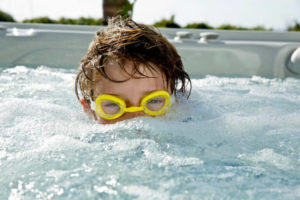 kid in salt water hot tub